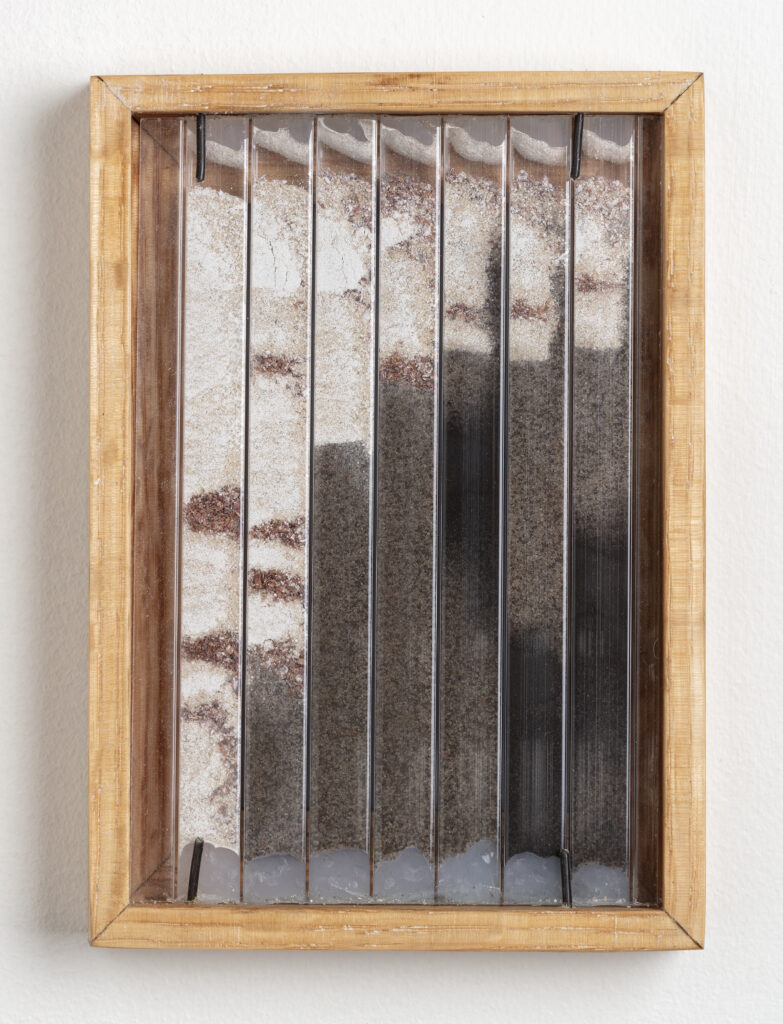 Abby Flanagan, tract (woodthrush) 7,2023, polycarbonate panel, plaster, sand, saw dust, charcoal, artist’s oak frame, 5 ¾ x 4 ¼ in.
